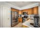 Kitchen with stainless steel appliances and wood cabinets at 12810 W Edgemont Ave, Avondale, AZ 85392