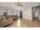 Living room with tiled floors, sectional sofa, and entryway at 12810 W Edgemont Ave, Avondale, AZ 85392