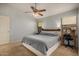 Main bedroom with king-size bed and built-in vanity at 12810 W Edgemont Ave, Avondale, AZ 85392