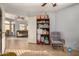 Bright playroom with built-in shelving and a comfy rocking chair at 12810 W Edgemont Ave, Avondale, AZ 85392