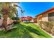 Landscaped backyard oasis with a pool and patio furniture at 13601 N 50Th Pl, Scottsdale, AZ 85254