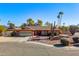 Single-story home with a two-car garage and desert landscaping at 13601 N 50Th Pl, Scottsdale, AZ 85254