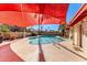 Relaxing pool area with a red shade structure at 13601 N 50Th Pl, Scottsdale, AZ 85254