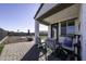 Patio furniture and view of grassy backyard beyond at 13658 W Sandridge Dr, Sun City West, AZ 85375