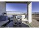 Patio furniture with a view of a lake and golf course at 13658 W Sandridge Dr, Sun City West, AZ 85375