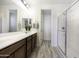 Modern bathroom with double vanity and walk-in shower at 13658 W Sandridge Dr, Sun City West, AZ 85375