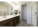 Modern bathroom with double vanity and walk-in shower at 13658 W Sandridge Dr, Sun City West, AZ 85375