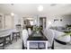 Open concept dining area with kitchen and living room views at 13658 W Sandridge Dr, Sun City West, AZ 85375