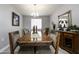 Elegant dining room with wood table and chandelier at 13658 W Sandridge Dr, Sun City West, AZ 85375