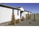 Rear view of home with desert landscaping at 13658 W Sandridge Dr, Sun City West, AZ 85375