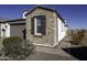 Side view of home with stone and stucco exterior at 13658 W Sandridge Dr, Sun City West, AZ 85375