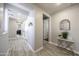 Light-filled hallway with wood-look floors at 13658 W Sandridge Dr, Sun City West, AZ 85375