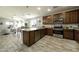 Modern kitchen with granite countertops and stainless steel appliances at 13658 W Sandridge Dr, Sun City West, AZ 85375