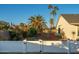 Large backyard with a playground, and a white fence at 15201 N 61St Ave, Glendale, AZ 85306