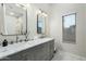 Elegant bathroom with double vanity, marble countertops, and modern fixtures at 15201 N 61St Ave, Glendale, AZ 85306