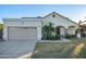 Single-story home with a two-car garage and landscaped front yard at 15201 N 61St Ave, Glendale, AZ 85306