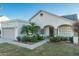 Front view of a single-story house with a fountain and palm trees at 15201 N 61St Ave, Glendale, AZ 85306