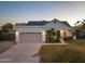 Exterior features a charming one-story home with a well-maintained lawn and landscaping at 15201 N 61St Ave, Glendale, AZ 85306