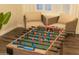 Fun game room, perfect for entertaining, features a foosball table at 15201 N 61St Ave, Glendale, AZ 85306