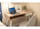 Home office features a simple desk, laptop, and chair, perfect for working from home at 15201 N 61St Ave, Glendale, AZ 85306