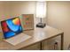 Home office with a desk, tablet, and lamp at 15201 N 61St Ave, Glendale, AZ 85306