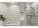 Clean bathroom with a shower/tub combo and updated tile at 16 W Encanto Blvd # 409, Phoenix, AZ 85003