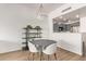 Dining area with a round table and four grey chairs at 16 W Encanto Blvd # 409, Phoenix, AZ 85003