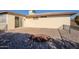 Small backyard with gravel, a paved patio and a small garden at 1722 Leisure World --, Mesa, AZ 85206