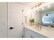 Modern bathroom with quartz countertop, gold fixtures, and large mirror at 1722 Leisure World --, Mesa, AZ 85206