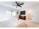 Main bedroom with ensuite bathroom, walk-in closet, and ceiling fan at 1722 Leisure World --, Mesa, AZ 85206