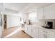 Modern kitchen featuring white cabinets, quartz countertops, and stainless steel appliances at 1722 Leisure World --, Mesa, AZ 85206