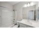 Clean bathroom with tub, single vanity, and mirror at 17852 W Country Club Ter, Surprise, AZ 85387