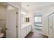 Main bathroom with double sinks and a view of the bedroom at 17852 W Country Club Ter, Surprise, AZ 85387