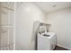 Laundry room with washer, dryer, and shelving at 17852 W Country Club Ter, Surprise, AZ 85387