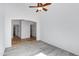 Bright bedroom with tile flooring and ceiling fan at 1803 N Desert Willow St, Casa Grande, AZ 85122