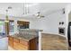 Kitchen island with granite countertops and wood cabinets at 1803 N Desert Willow St, Casa Grande, AZ 85122