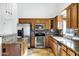 Spacious kitchen with granite countertops and wood cabinets at 1803 N Desert Willow St, Casa Grande, AZ 85122