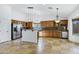 Kitchen with wood cabinets, granite counters and stainless steel appliances at 1803 N Desert Willow St, Casa Grande, AZ 85122