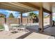 Relaxing patio with table and chairs near pool at 1803 N Desert Willow St, Casa Grande, AZ 85122