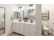 Bright bathroom with double sink vanity and white-washed wood planked walls at 1814 W Desert Spring Way, San Tan Valley, AZ 85144