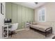 Cozy bedroom featuring a minimalist bed, study desk, and olive green wainscotting at 1814 W Desert Spring Way, San Tan Valley, AZ 85144