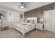 Neutral bedroom featuring a large window, carpet flooring and decorative wall trim at 1814 W Desert Spring Way, San Tan Valley, AZ 85144