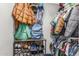 Walk-in closet provides generous storage with hanging racks, shelves, and shoe storage at 1814 W Desert Spring Way, San Tan Valley, AZ 85144