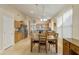 Bright dining area with wood table and chairs, kitchen view at 1918 E Saratoga St, Gilbert, AZ 85296