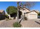 Single story home with arched entryway and mature tree at 1918 E Saratoga St, Gilbert, AZ 85296