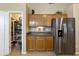 Walk-in pantry and stainless steel refrigerator at 1918 E Saratoga St, Gilbert, AZ 85296