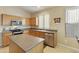 Modern kitchen featuring stainless steel appliances and ample wood cabinetry at 1918 E Saratoga St, Gilbert, AZ 85296