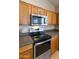 Kitchen with stainless steel appliances and wood cabinets at 1918 E Saratoga St, Gilbert, AZ 85296