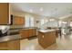 Kitchen with wood cabinets, stainless steel appliances, and an island at 1918 E Saratoga St, Gilbert, AZ 85296