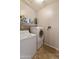 Convenient laundry room with washer, dryer, and storage at 1918 E Saratoga St, Gilbert, AZ 85296